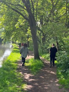 Group of people walking through woods